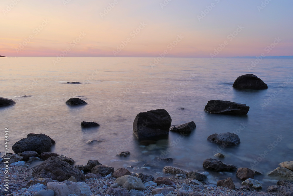 sunset at sea with rocks and colorful sky sunset at sea with rocks and colorful sky