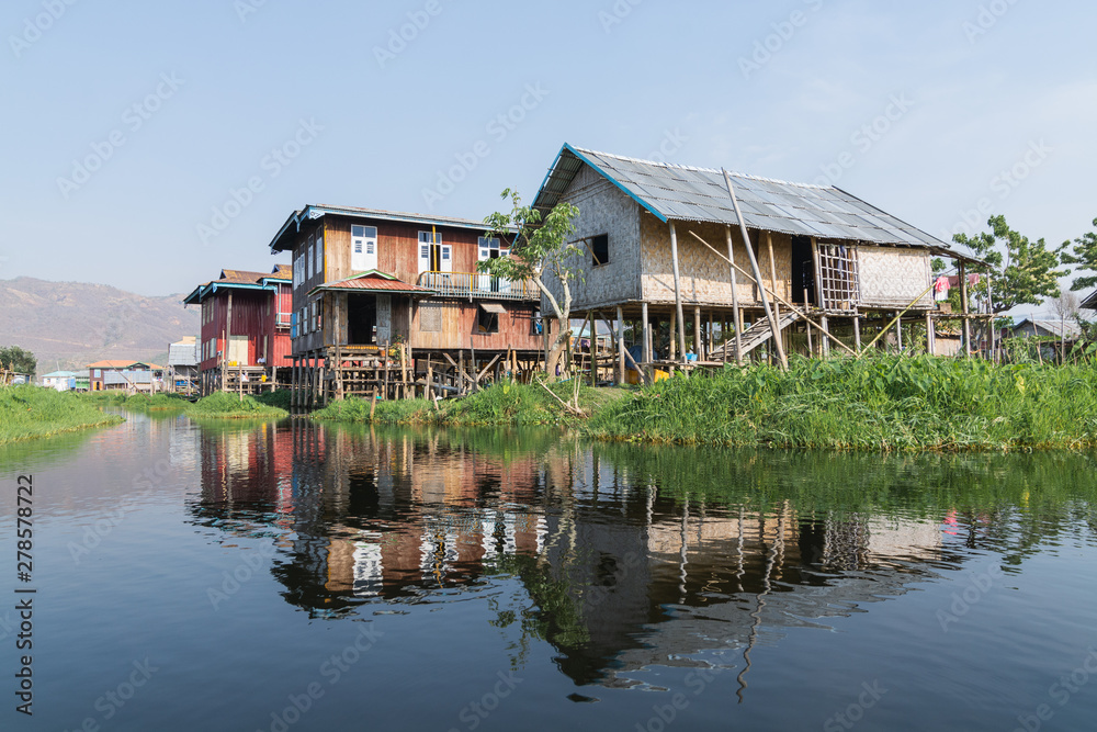 Traditional Burmese floating house on water in Inle lake, Myanmar Traditional Burmese floating house on water in Inle lake, Myanmar