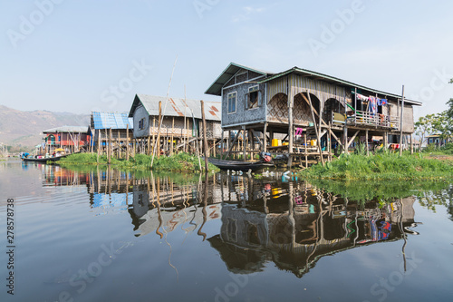 Traditional Burmese floating house on water in Inle lake, Myanmar photo
