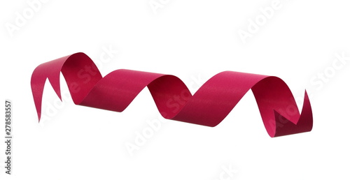 Red ribbon and roll isolated on white background. Flat lay.