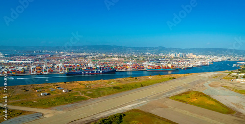 Oakland Harbor port terminal with cargo ship and shipping containers © Tierney