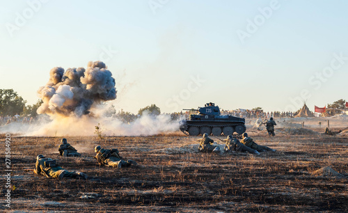 Explosions of bombs and shells. Reconstruction of the battle of world war II. Battle for Sevastopol. Reconstruction of the battle with explosions. Tanks and soldiers during the battle.