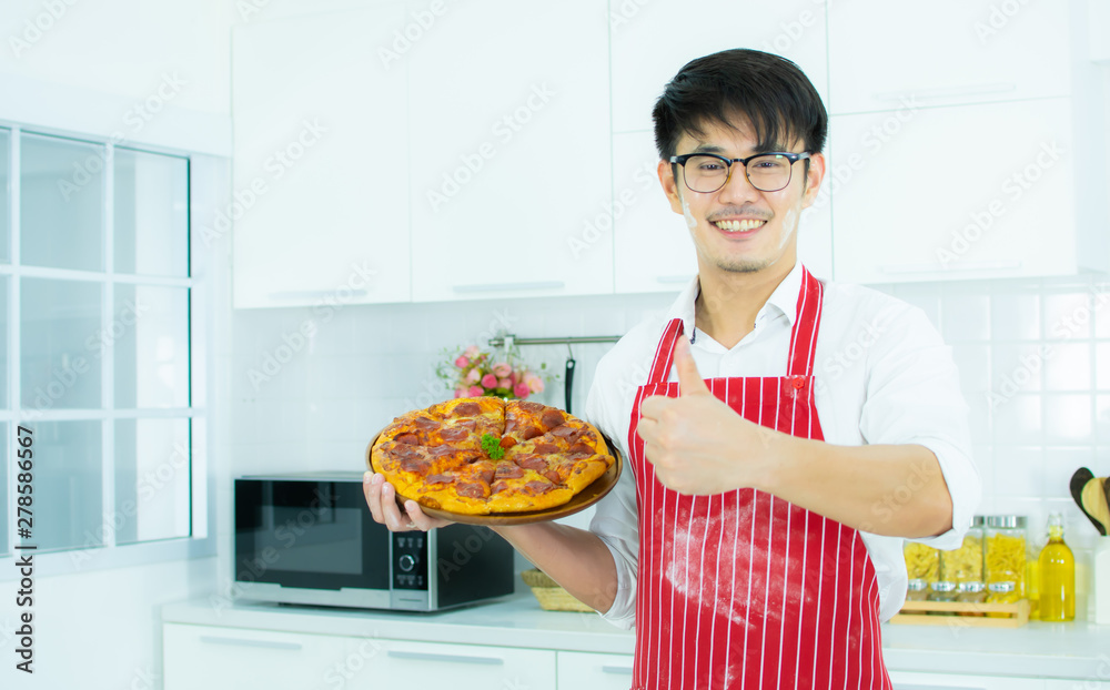 A man is preparing a pizza