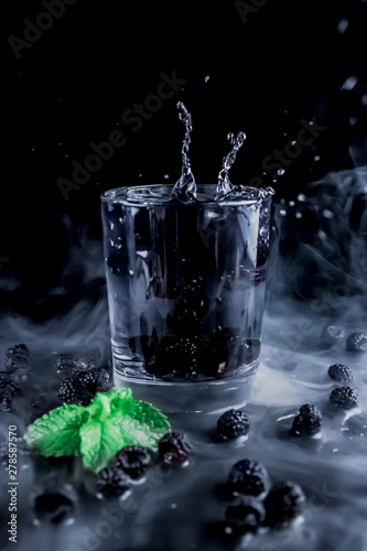 Natural water, water with blackberry, splash in a glass, water for health, refreshing drinks, healthy concept