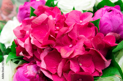 flowers are pink hydrangeas and peonies, delicate petals