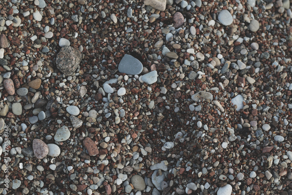 lot of small pebbles on the beach lot of small pebbles on the beach