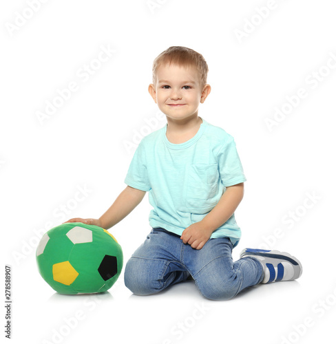 Cute little child with soft soccer ball on white background. Playing indoors