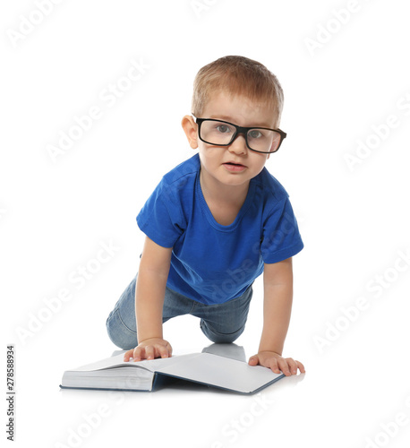 Little child with eyeglasses and book on white background