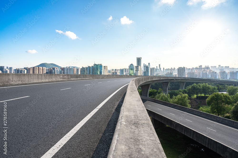 city skyline with empty road city skyline with empty road