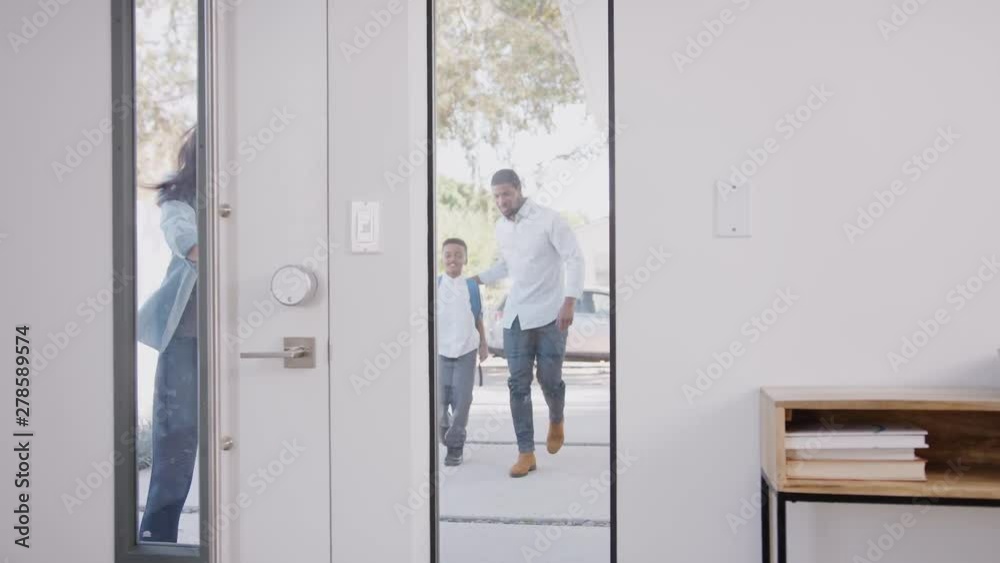 Parents Bringing Excited Children Back Home From School Opens Front Door Of House Parents Bringing Excited Children Back Home From School Opens Front Door Of House