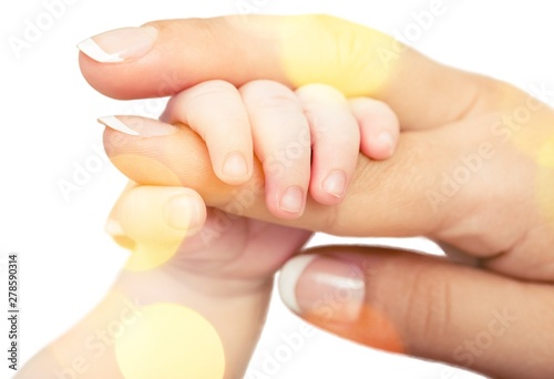 Close up photo of father holding baby hand