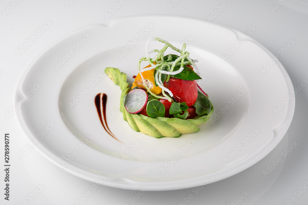 Salad of grilled vegetables in combination with fresh vegetables, cheese and sprouts of micro greens. Nutritious healthy dish. Banquet festive dishes. Gourmet restaurant menu. White background. Salad of grilled vegetables in combination with fresh vegetables, cheese and sprouts of micro greens. Nutritious healthy dish. Banquet festive dishes. Gourmet restaurant menu. White background.