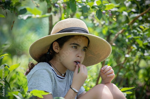 Girl eating berry