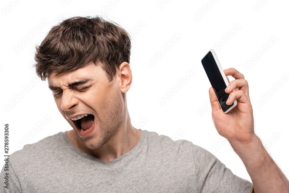 upset handsome man with closed eyes holding smartphone isolated on white upset handsome man with closed eyes holding smartphone isolated on white