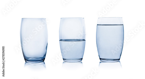 Empty, half and full glasses of water on white background