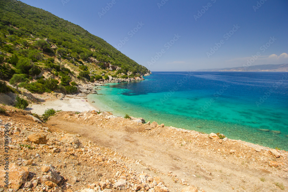 Vouti beach, Kefalonia island, Greece. People relaxing at the beach. Vouti beach, Kefalonia island, Greece. People relaxing at the beach.