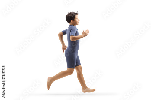 Fotografi Boy in a wetsuit running