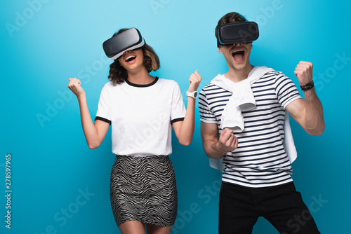cheerful man and woman danc...