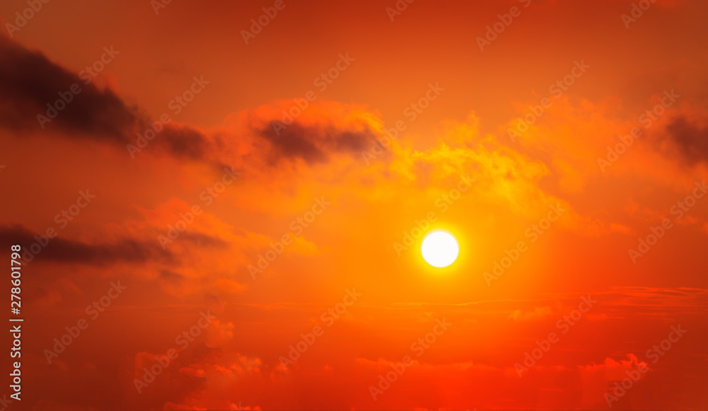 red sky with sun and clouds