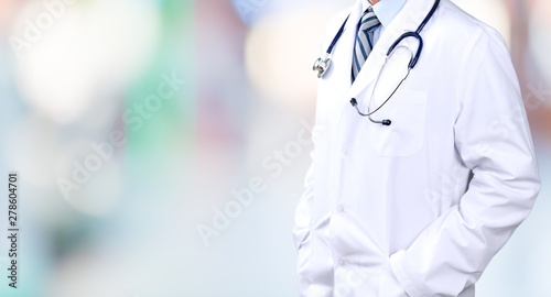 Portrait of doctor with stethoscope on blurred background