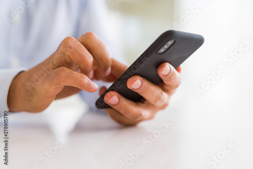 Close up of business man hands using smarpthone