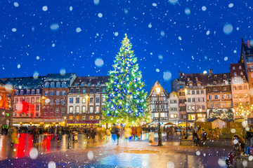 Christmas tree and xmas market at Kleber Square at night  in medieval city of Strasbourg - capital of Noel, Alsace, France.