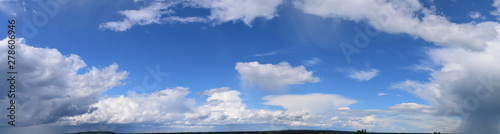 Clouds against the blue sky. Atmospheric phenomenon-vaporization, visible to the naked eye, panorama.