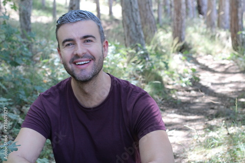 Handsome man with gray hair outdoors
