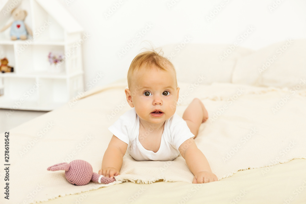 Portrait of happy smile baby relaxing on the bed Portrait of happy smile baby relaxing on the bed