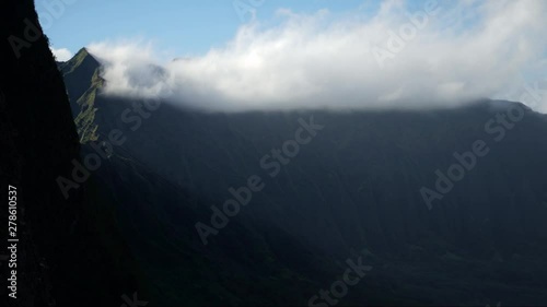 Timelipse of Stratus Clouds Hitting Peaks of Nuuanu Pali Ridges on Oahu Island Hawaii, View From Pali Notches. photo