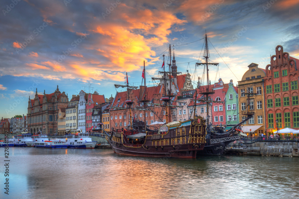 Beautiful old town of Gdansk over Motlawa river at sunset, Poland.