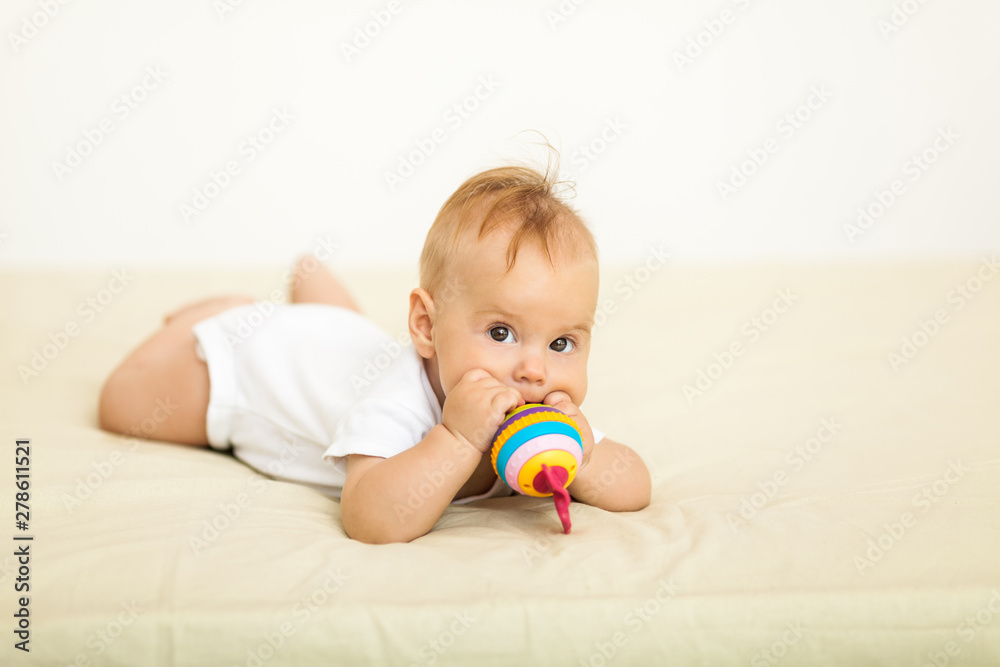 Portrait of happy smile baby relaxing on the bed Portrait of happy smile baby relaxing on the bed