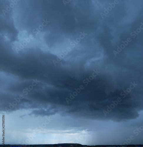 Heavy storm clouds, panorama. Powerful cumulonimbus clouds in front of heavy rain or hail.