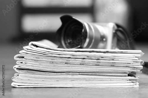 Newspapers and Photo Camera. Concept for News and Journalism