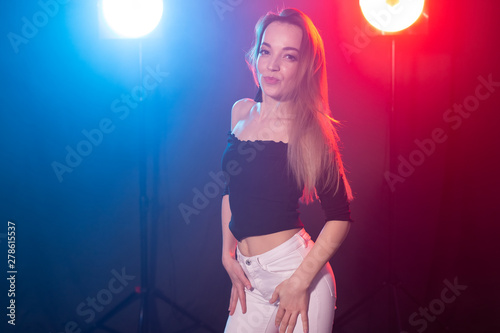 Young woman dancing in the dark, emotions and enjoyment © satura_