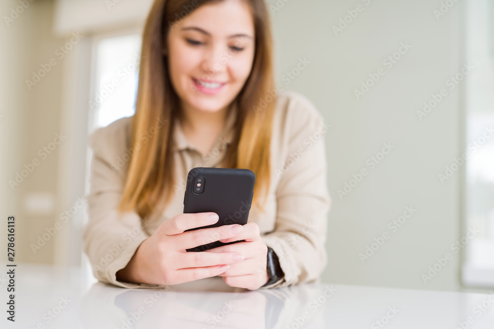 Close up of woman using smartphone and smiling confident Close up of woman using smartphone and smiling confident