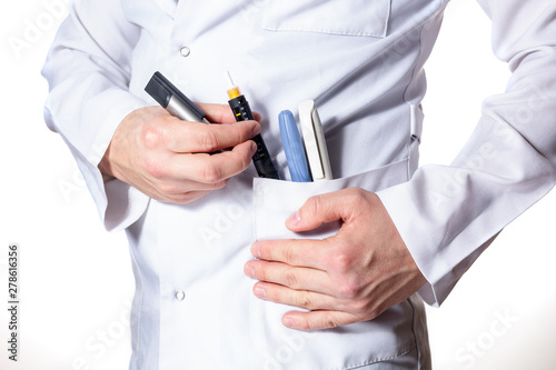 Doctor holding in hand insulin pen in his pocket on isolated white background