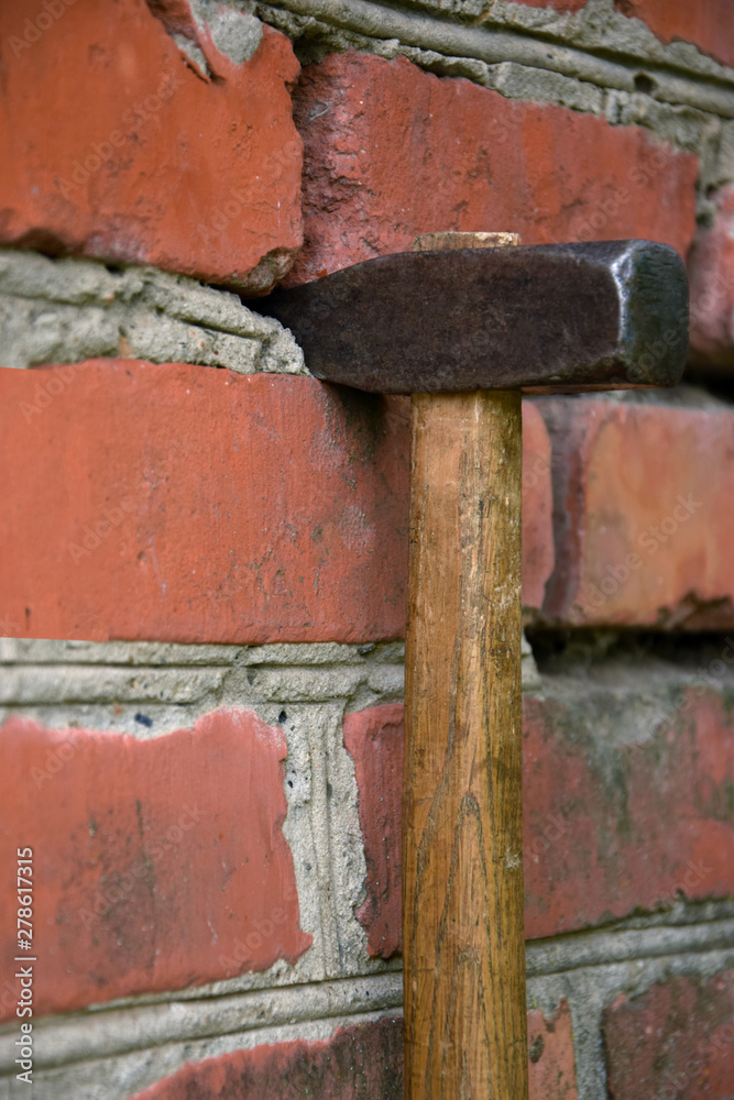 The photo shows a hammer that stuck into the wall. This photo symbolizes the achievement of the goal. Even the strongest wall can be broken, if there is a big goal ahead that the heart responds!