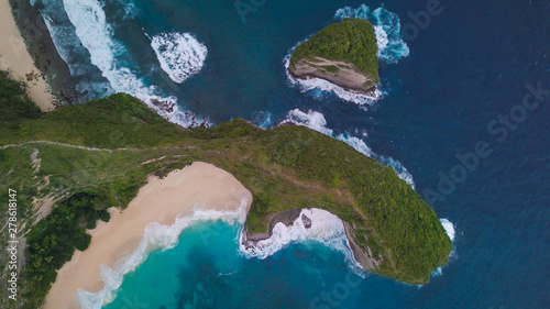 Top aerial view of the t-rex cliff at Kelingking beach ona fine bright day in Nusa Penida, Indonesia photo