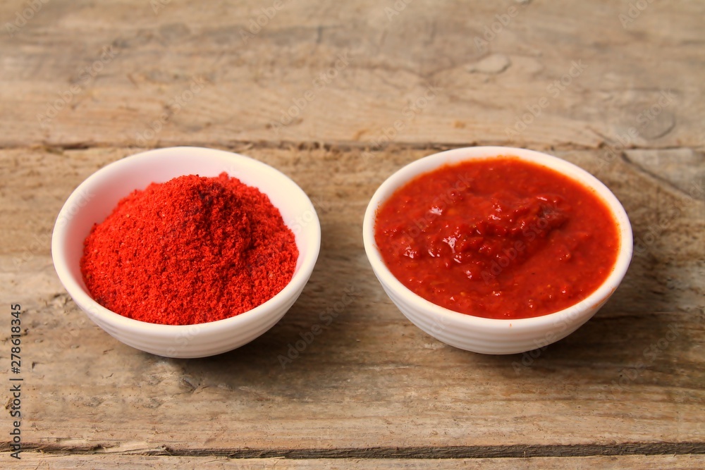 Traditional Maghrebi food: hot chili pepper powder and sauce paste harissa. Tunisia and Arabic cuisine adjika Traditional Maghrebi food: hot chili pepper powder and sauce paste harissa. Tunisia and Arabic cuisine adjika
