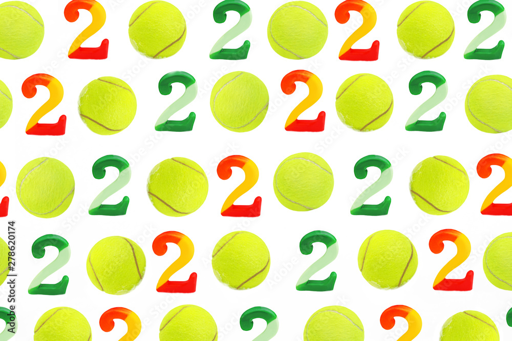 Tennis Christmas and 2020 New Year pattern with tennis balls and numbers on white snow, isolated. Top view, flat lay, copy space. Winter sport healthy layout. Holiday conception.