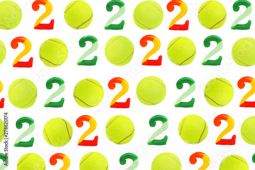 Tennis Christmas and 2020 New Year pattern with tennis balls and numbers on white snow, isolated. Top view, flat lay, copy space. Winter sport healthy layout. Holiday conception. © IrynaV