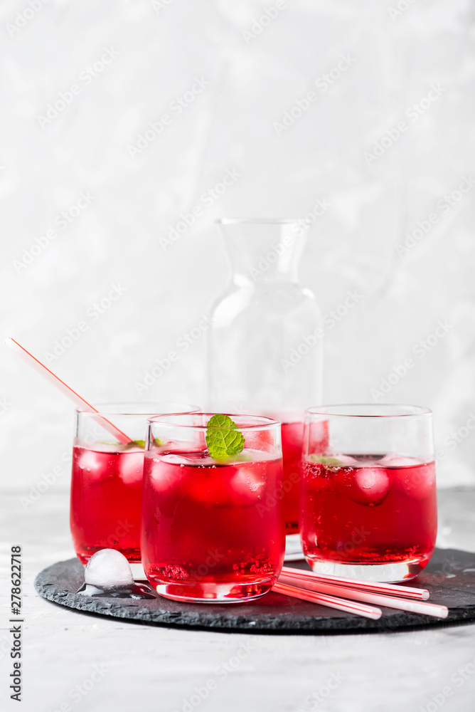 Red alcoholic coctail with ice and mint Red alcoholic coctail with ice and mint