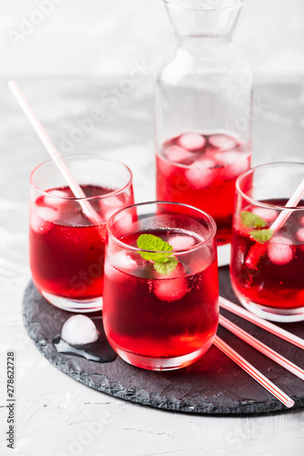 Red alcoholic coctail with ice and mint