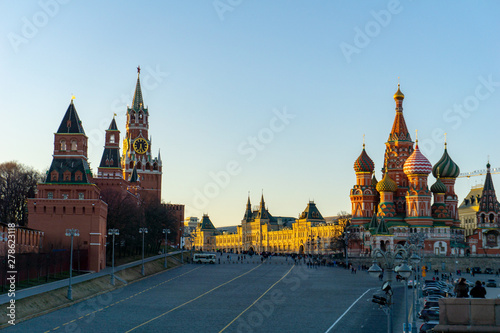 Moscow, Russia, May 30, 2019: St. Basil's Cathedral and Kremlin Walls and Tower in Red square in sunny blue sky
