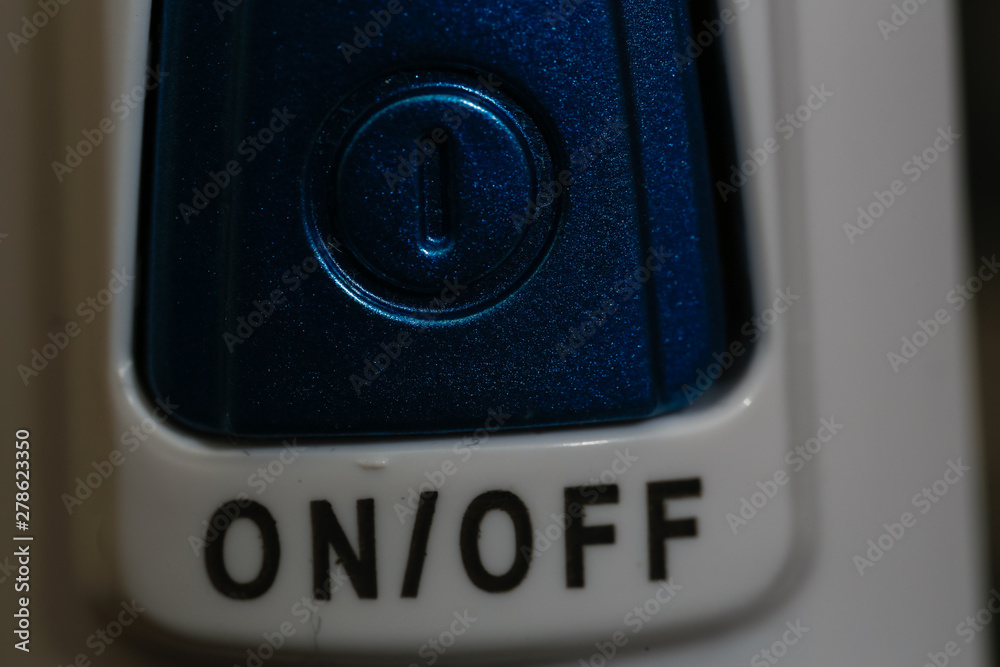 blue and white on off button close up macro image