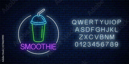 Neon glowing sign of smoothie in circle frame with alphabet. Fastfood light billboard symbol. Cafe menu item.