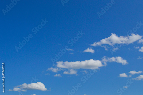 Beautiful blue sky bright sunny with white fluffy clouds picturesque. Background  wallpaper  texture