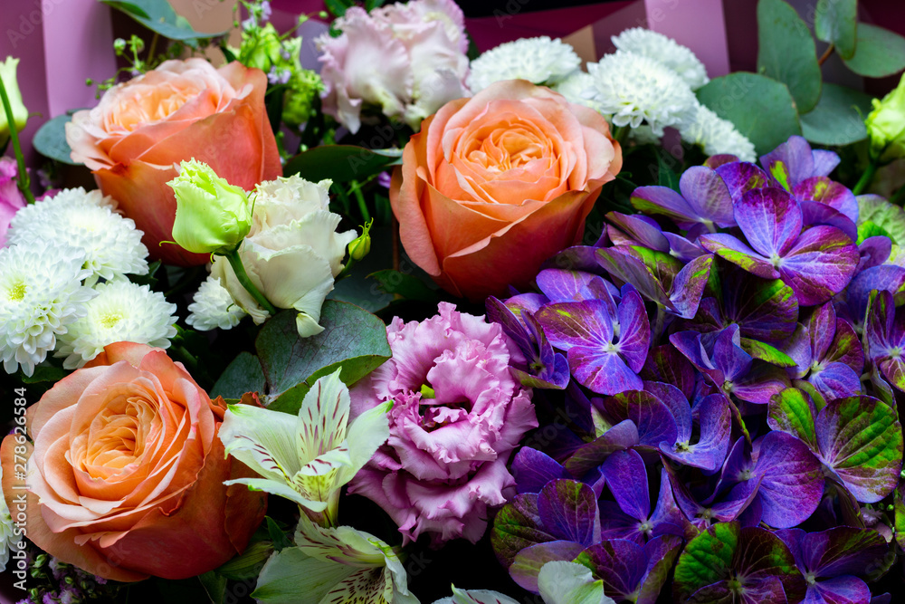 bright contrasting bouquet assembled from hydrangea, peony rose, chrysanthemum, eustoma and alstroemeria close-up