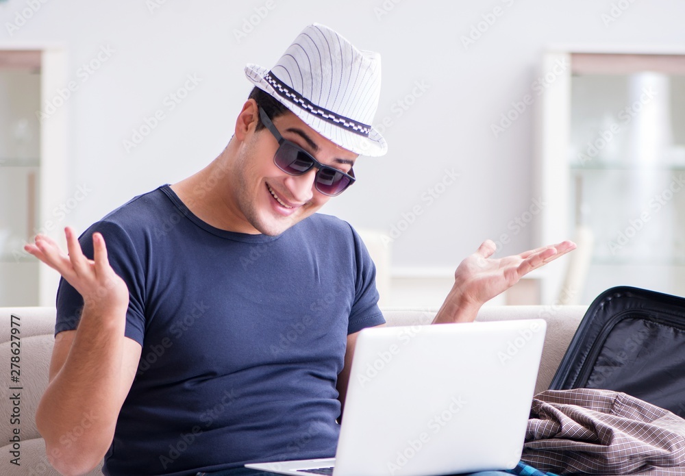 Man booking online his travel flight and hotel Man booking online his travel flight and hotel